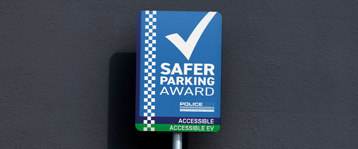 Safer Parking Accessible EV award displayed on car park signage