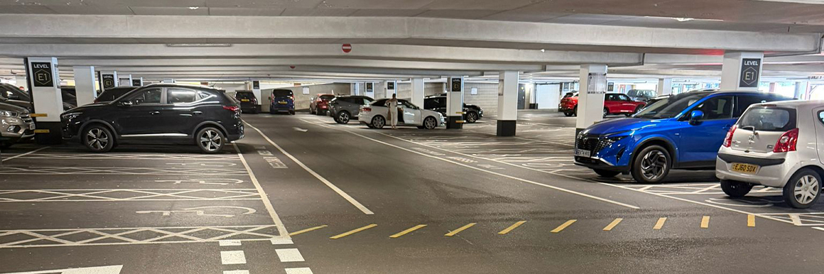 Well illuminated car park with clear pedestrian routes and signage