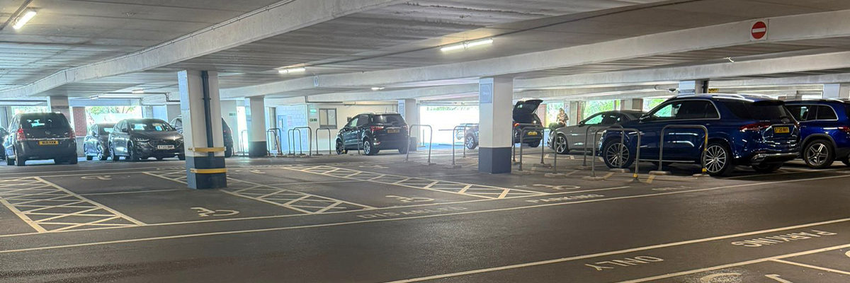 An underground car park with accessible bays and good lighting
