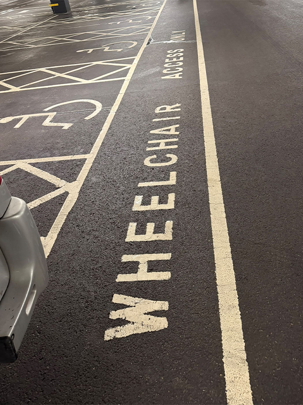 Wheelchair access only markings on disabled bays