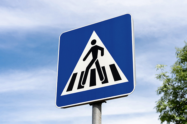 A pedestrian crossing sign