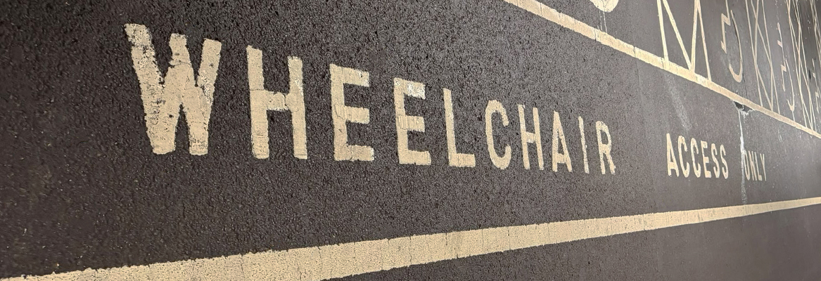 Car park markings stating wheelchair accessibility only