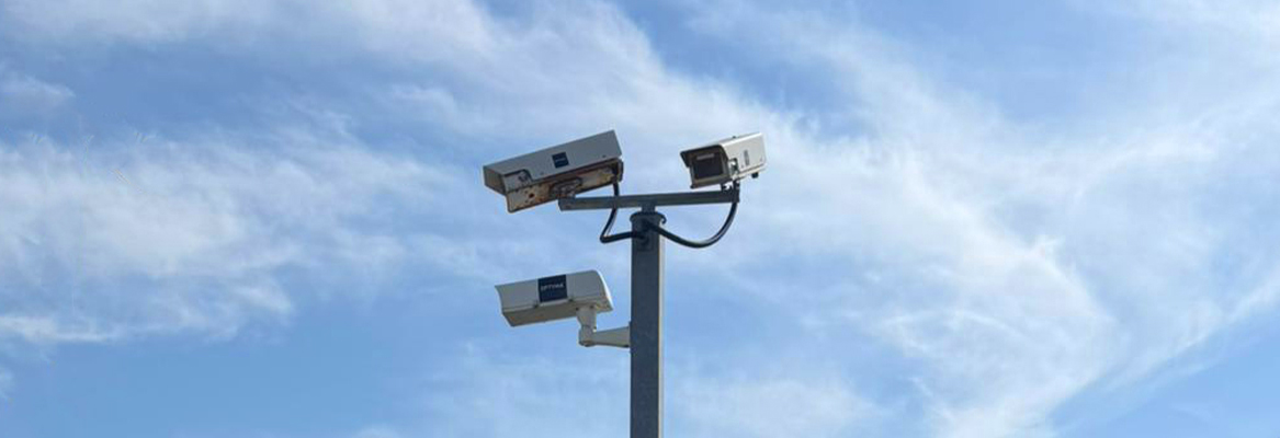 Three CCTV cameras pointed in different directions to monitor car park